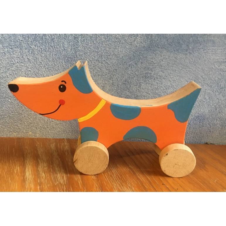 Wooden dog on wheels