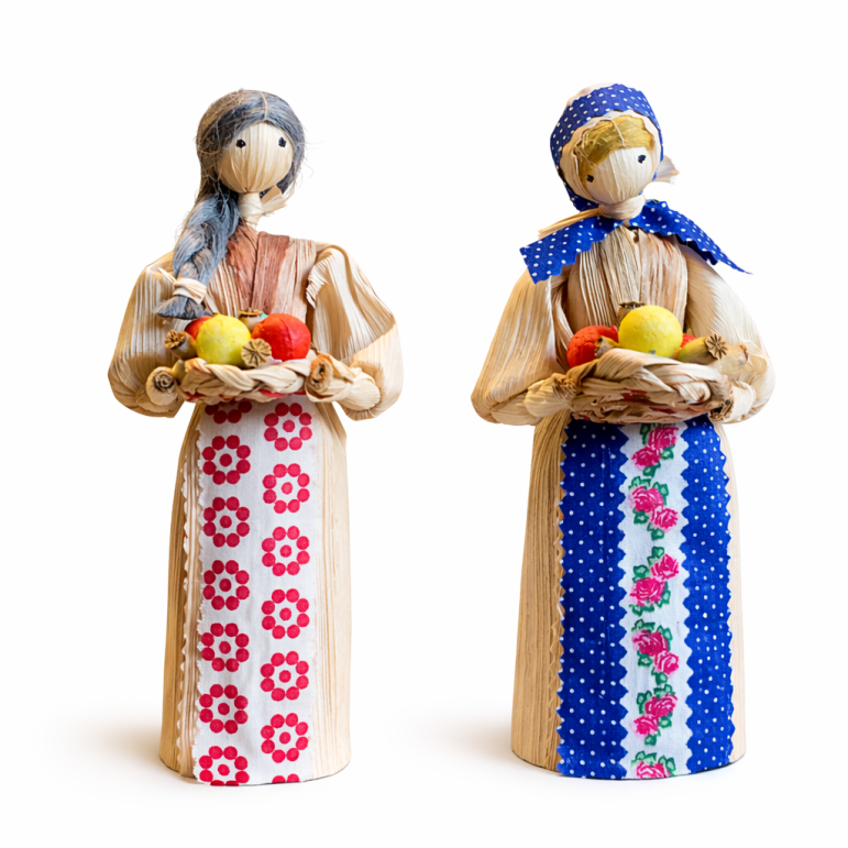 Corn husk doll with apples